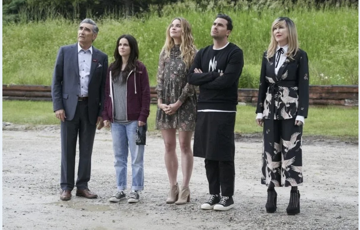 rose family and stevie budd outside the motel in schitt's creek